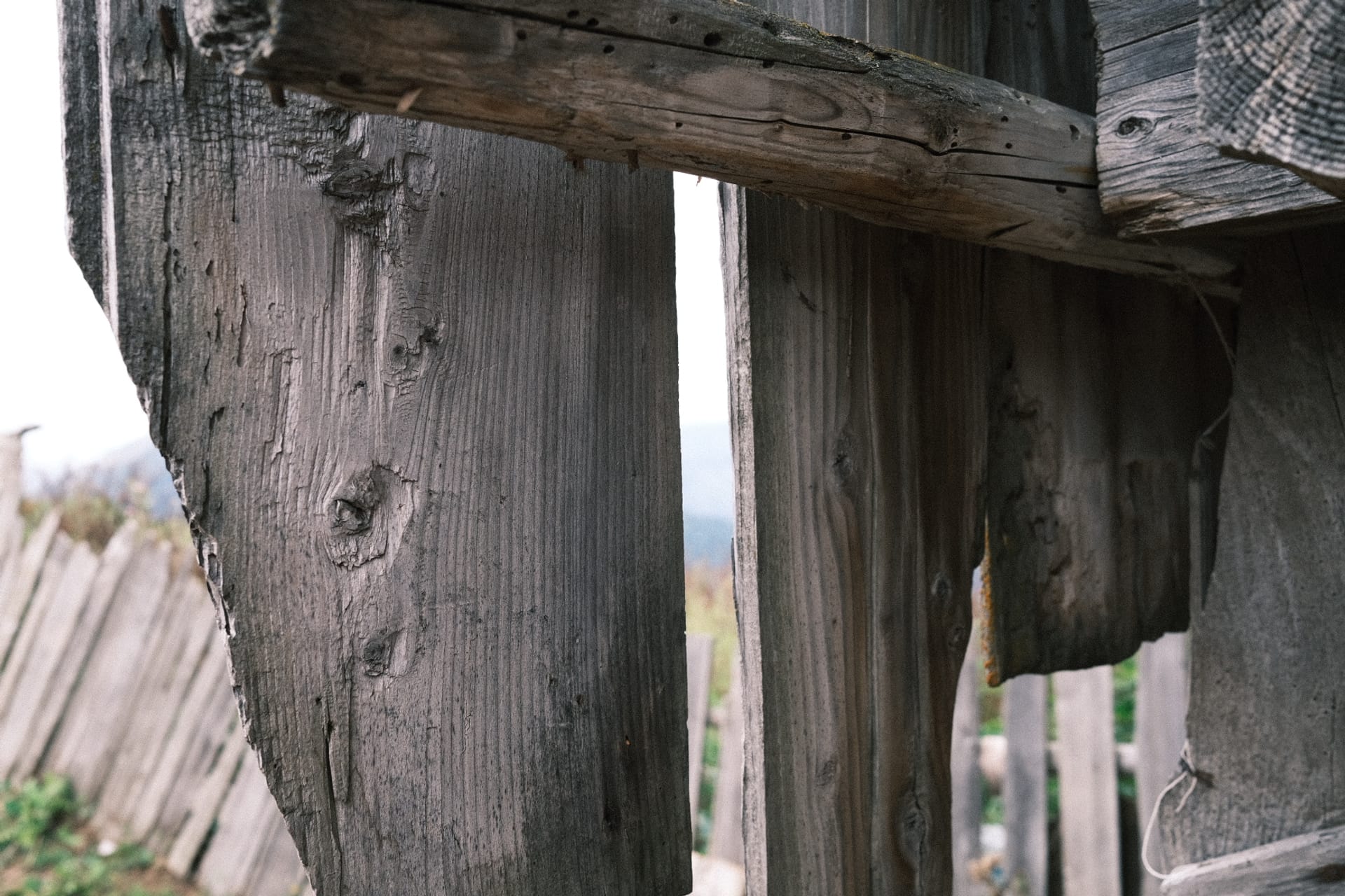 Weathered wooden fence and barn boards in a Georgian mountain village